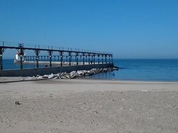 bridge to the lighthouse across the blue water