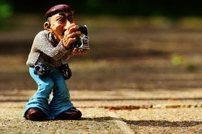 the figurine of the photographer on the track