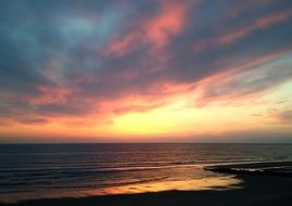 colorful sky with clouds on the horizon at dusk