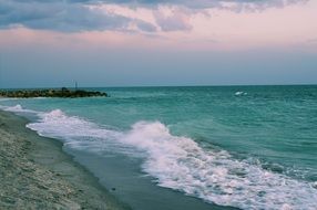 green waves on the shore of the island