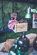 military tent with wooden shelves