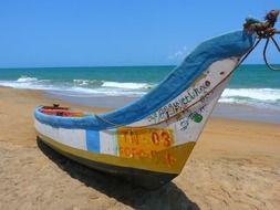 colorful boat on the beach on a sunny day