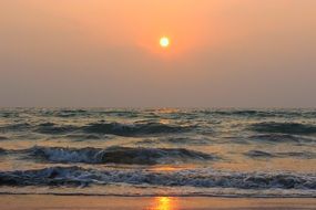 Beach under the sunset in the evening