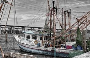 Panorama with the fishing old boat in harbor