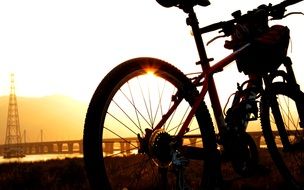 bike in the rays of a bright sunset