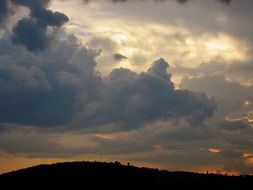 cumulus huge clouds at sunset