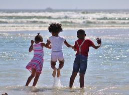 children near the ocean