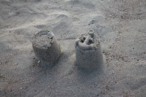 sand forms with anchor on beach