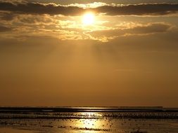 Wadden sea at the colorful bright sunset in East Frisia