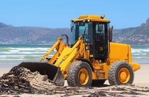 excavators cleaning the beach