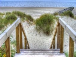 staircase to a sandy beach