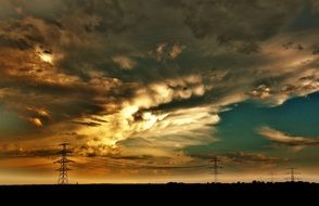 evening clouds over power lines