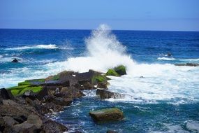 breakwater of ocean waves water sprays