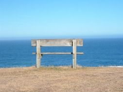 Alone bench near the ocean