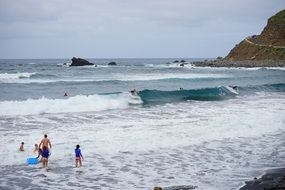 surfmen on sea waves
