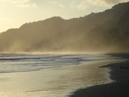 beach in haze near the ocean