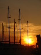 romantic sunset with sailing vessels