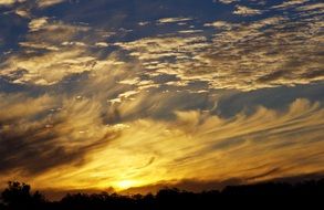 Yellow sunset in clouds