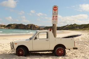 car on the beach at the sign not enter