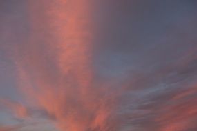 pink clouds in the sky during sunset