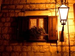 lantern near a traditional house in croatia