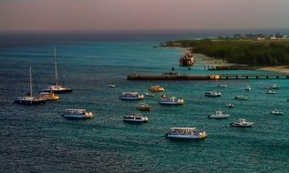 boats on sea at coastline, caribbean
