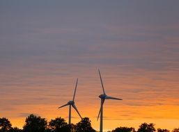 windmills on an orange sunset background