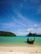 Beach near the ocean with clear blue water in Thailand