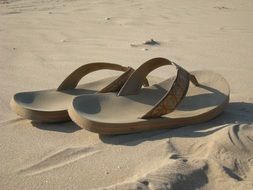 flip flops sandals on the sand