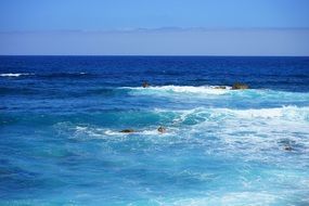 sea white waves in blue water