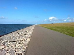 asphalt road along seashore