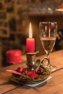 red candle and champagne glass