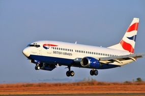 plane of british airlines over the runway