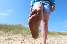 foot in beach sand