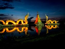 installation in the form of a dragon on the lake