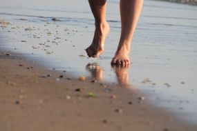 bare feet on a sandy beach on the North Sea