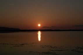 sunset orbetello sea