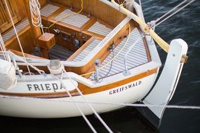 white boat on the water with sails