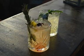 cocktail with lemon herbs and ice