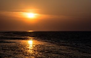 sunset over the ocean coast