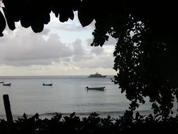 boats in scenic bay at duck, tobago, charlotteville