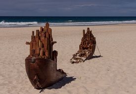 wooden ship broken on the sand