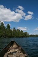 wooden canoe on a lake in minnesota