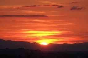 fire orange sunset in mountains