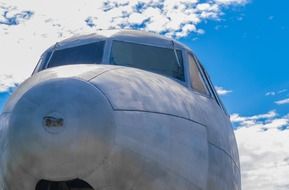 the nose of a combat aircraft against the sky