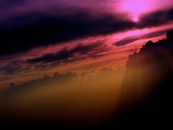 mountains in the haze on a background of purple sunset