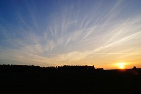 cirrus clouds in colorful sky at sunset