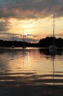 distant view of boats at Stockholm archipelago at sunset