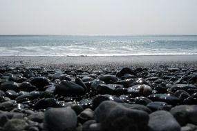 stones on the beach near the water