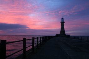 pink sunset over lighthouse in sunderland